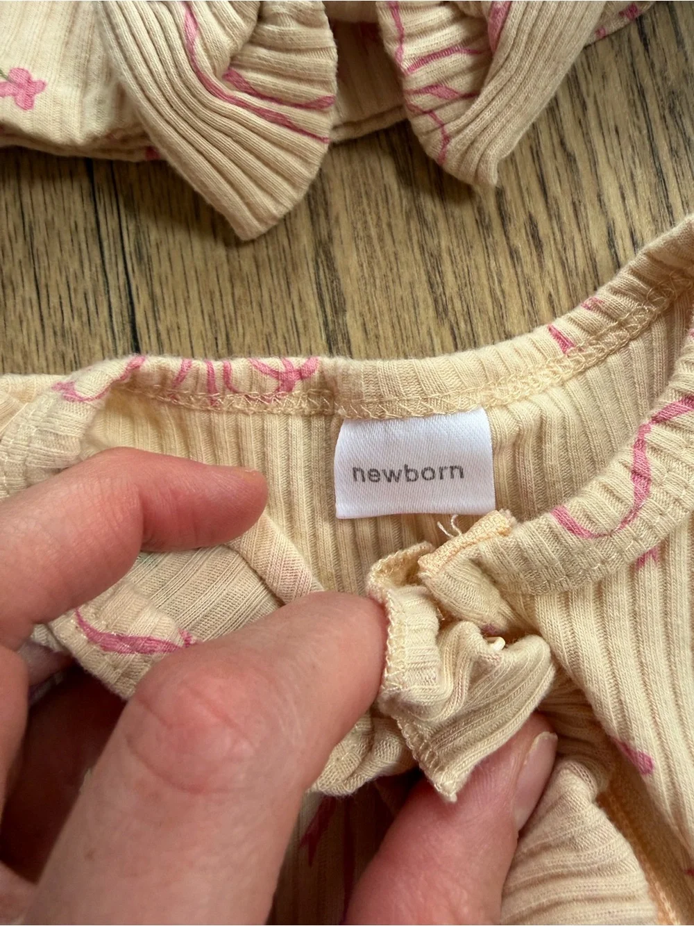 Neutral Cream Ribbed One-Piece with Pink Bow Print and Ruffle Trim and Headband